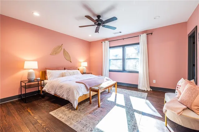 a bedroom with a bed and window