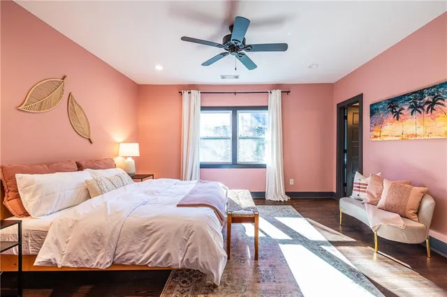 a bedroom with a bed window and couch