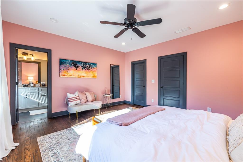 988 Mayson Turner Road Northwest Atlanta, GA 30314 - Photo 33 of 45 a bedroom with a bed and wooden floor