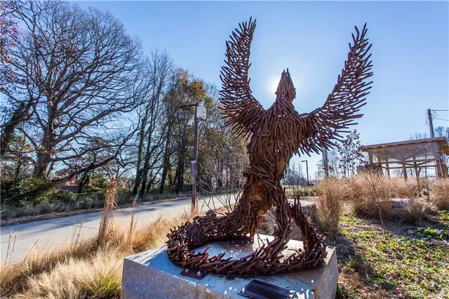 a view of a swimming pool with a yard and plants