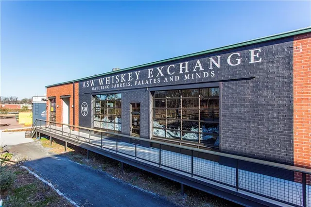 a front view of a building with glass windows and door