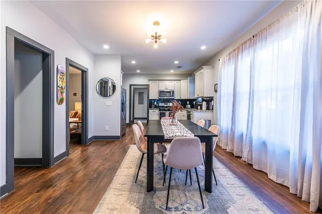 a view of a dining room with furniture window and wooden floor