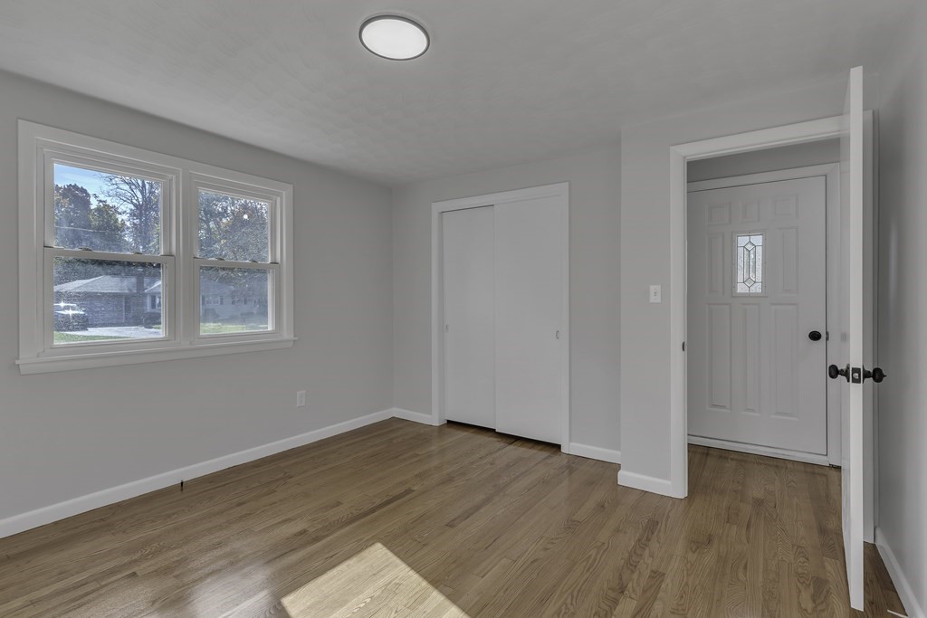 121 Herrman Street West Springfield, MA 01089 - Photo 13 of 40 a view of a room with wooden floor and windows