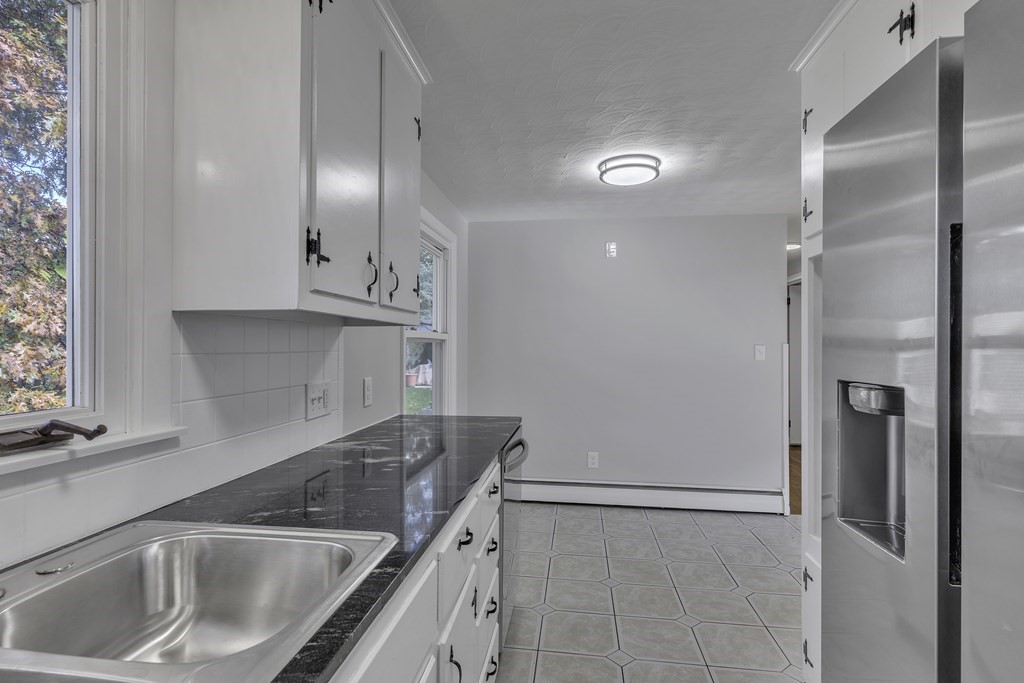 121 Herrman Street West Springfield, MA 01089 - Photo 23 of 40 a kitchen with a sink and refrigerator