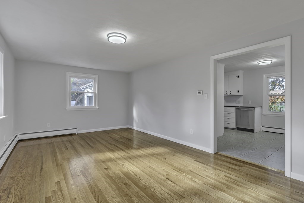 121 Herrman Street West Springfield, MA 01089 - Photo 28 of 40 an empty room with wooden floor and a window