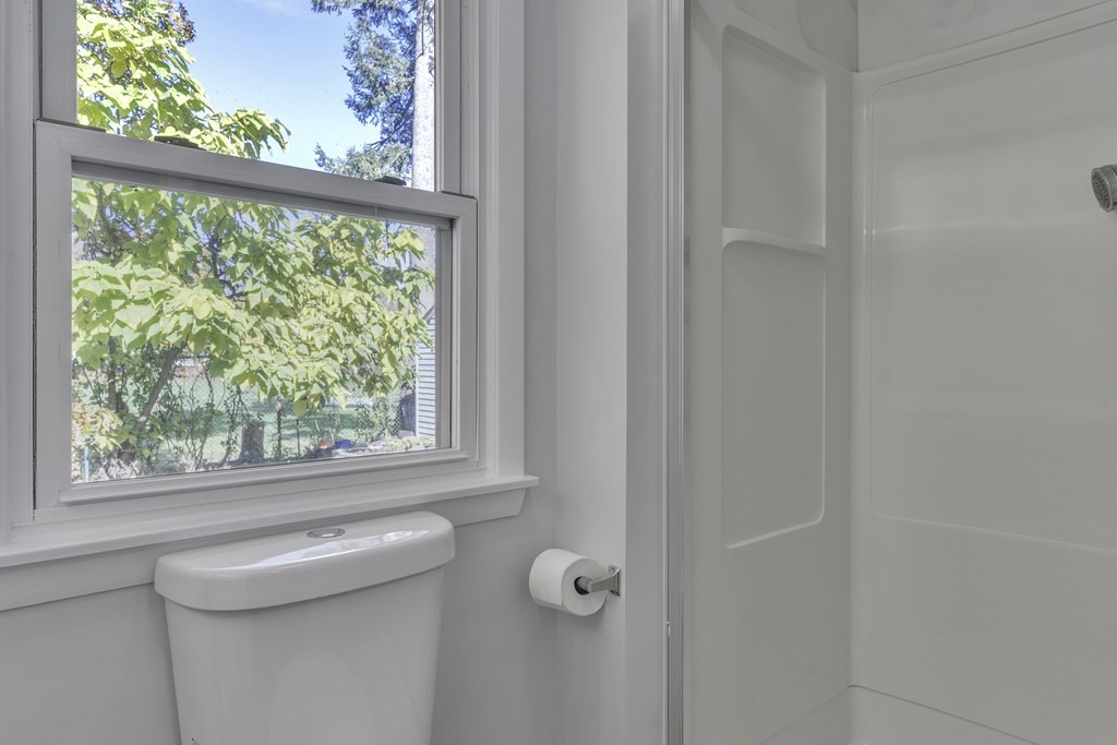 121 Herrman Street West Springfield, MA 01089 - Photo 6 of 40 a bathroom with a sink a window and a shower