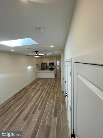 a kitchen with kitchen island a sink stainless steel appliances and cabinets
