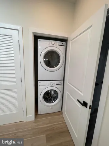 a view of a hallway with washer and dryer