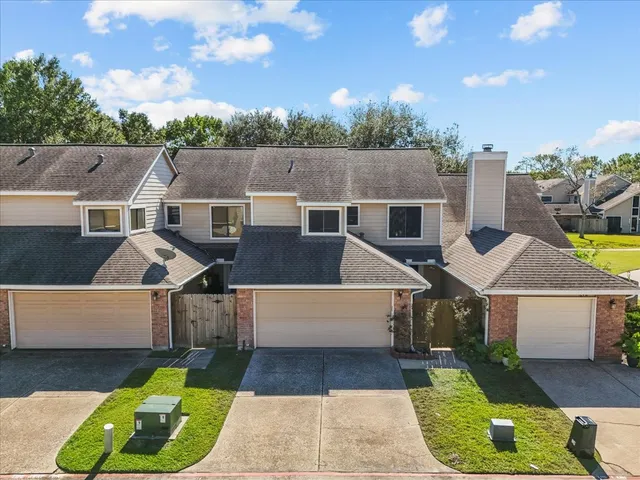 an aerial view of a house with swimming pool