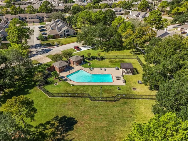 an aerial view of residential houses with outdoor space