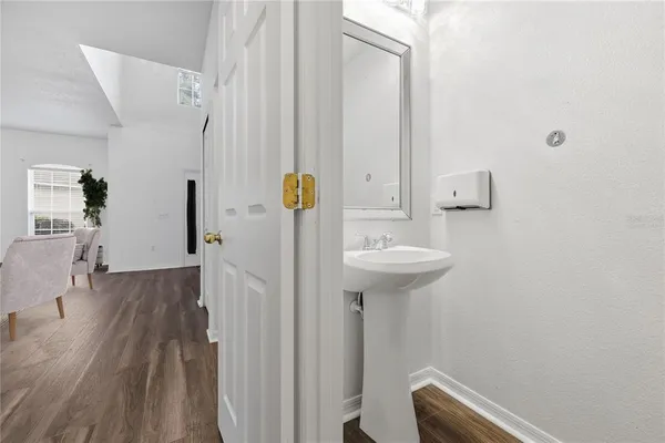 a bathroom with a sink and shower