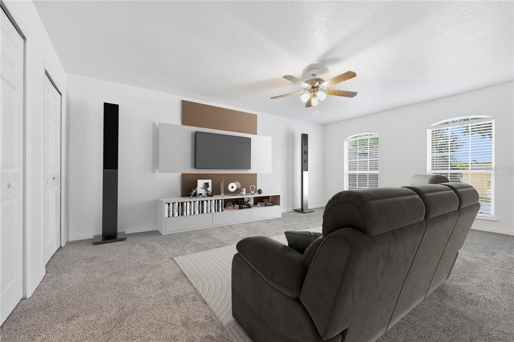 1348 Southwest 245th Way Newberry, FL 32669 - Photo 17 of 38 a living room with furniture and a flat screen tv