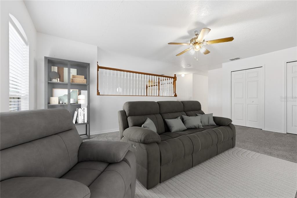 1348 Southwest 245th Way Newberry, FL 32669 - Photo 18 of 38 a living room with furniture and a large window