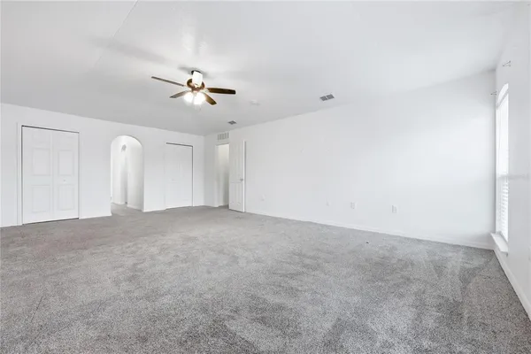 a view of a room with ceiling fan