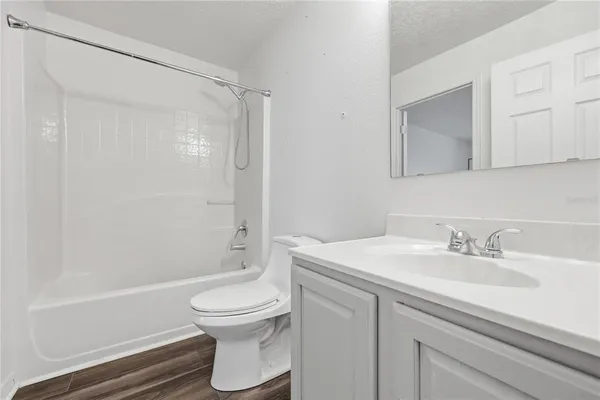 a bathroom with a sink a toilet and a bathtub