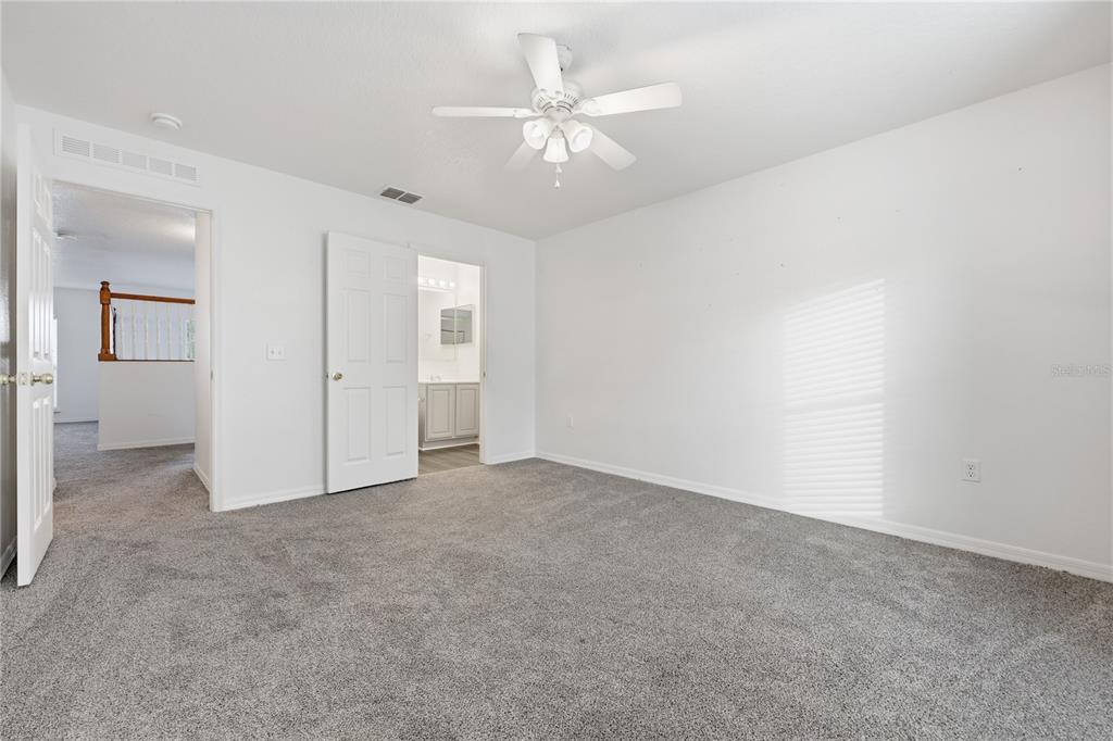 1348 Southwest 245th Way Newberry, FL 32669 - Photo 32 of 38 an empty room with fan and a ceiling fan
