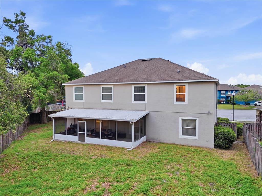 1348 Southwest 245th Way Newberry, FL 32669 - Photo 34 of 38 a front view of a house with a garden and porch