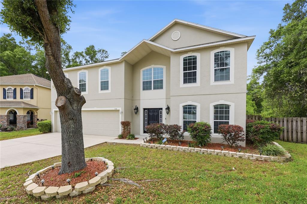 1348 Southwest 245th Way Newberry, FL 32669 - Photo 38 of 38 a front view of house with yard and green space
