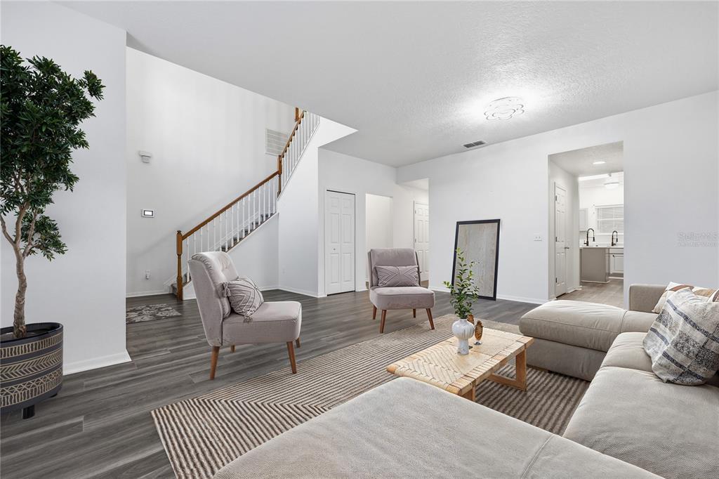 1348 Southwest 245th Way Newberry, FL 32669 - Photo 5 of 38 a living room with furniture and wooden floor