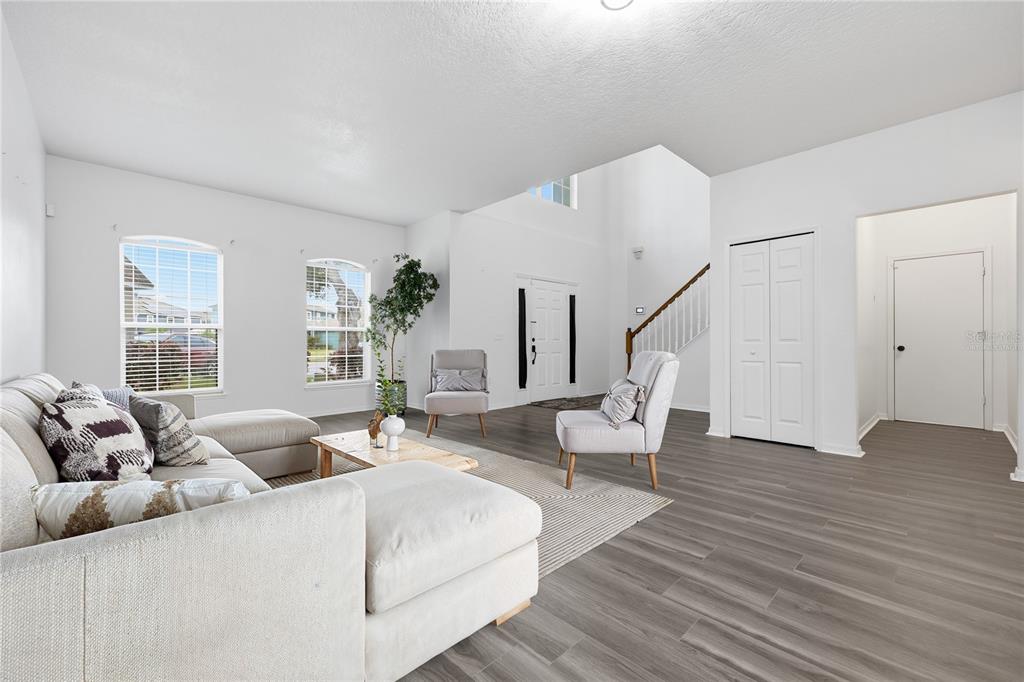 1348 Southwest 245th Way Newberry, FL 32669 - Photo 6 of 38 a living room with furniture and wooden floor