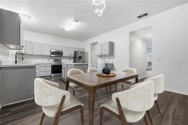 a view of kitchen with cabinets and wooden floor