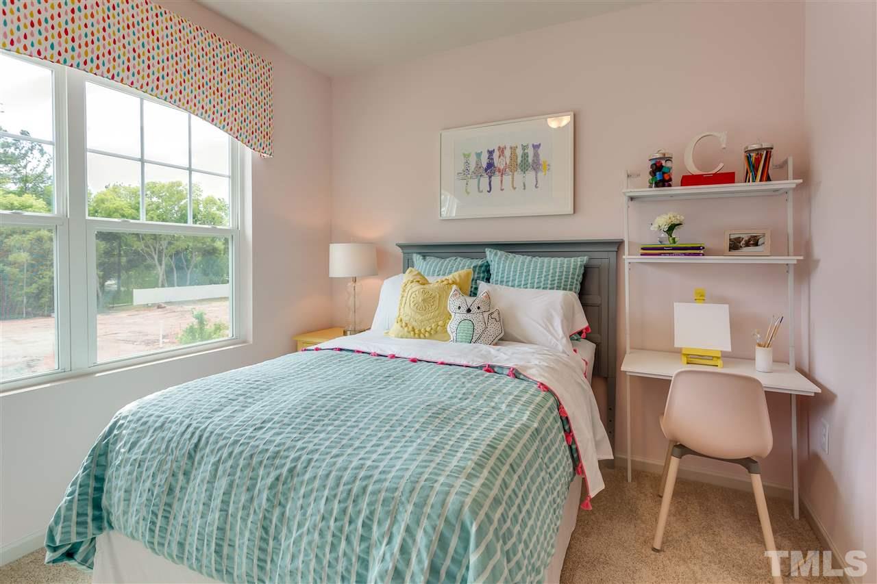 6123 Beale Loop, Unit 51 ABBEY Raleigh, NC 27616 - Photo 10 of 10 a bedroom with a bed and a window