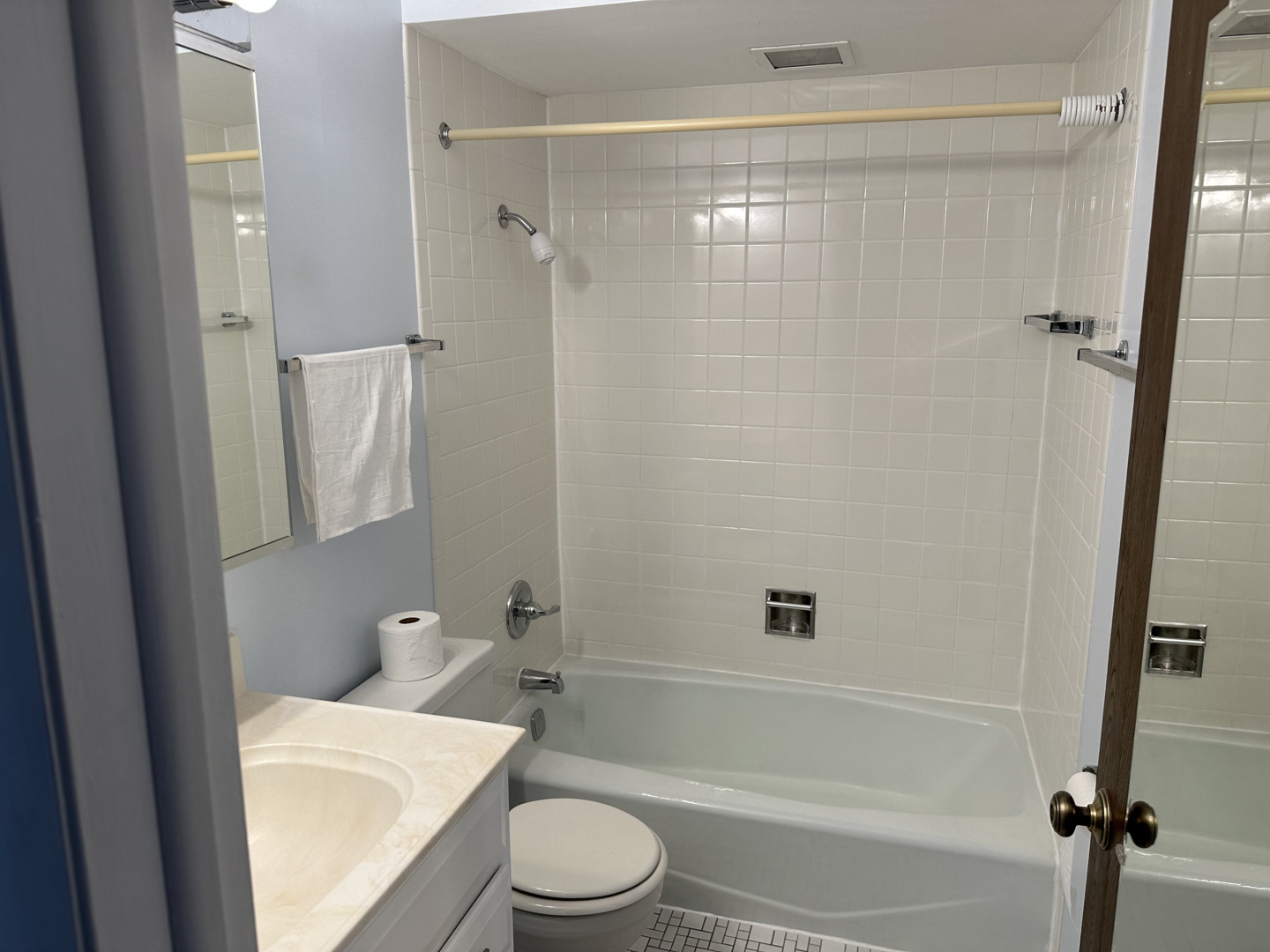 712 Cobblestone Circle, Unit E Glenview, IL 60025 - Photo 8 of 10 a bathroom with a granite countertop bathtub shower sink vanity and toilet