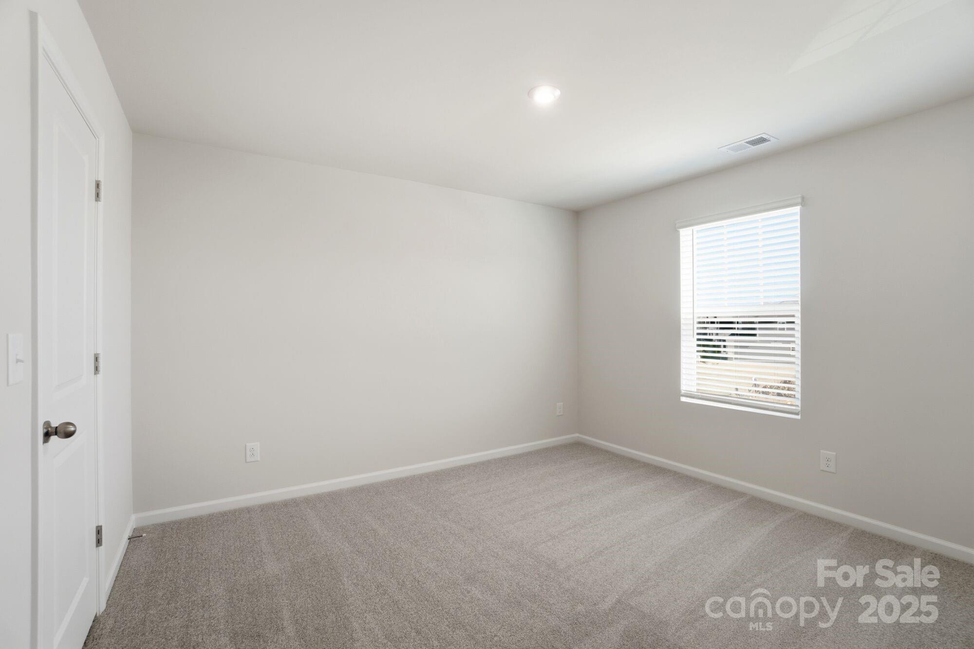 2664 Tillman Street Monroe, NC 28112 - Photo 16 of 25 an empty room with a window