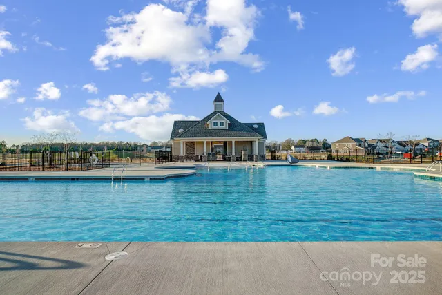 a view of a lake with a house in the background
