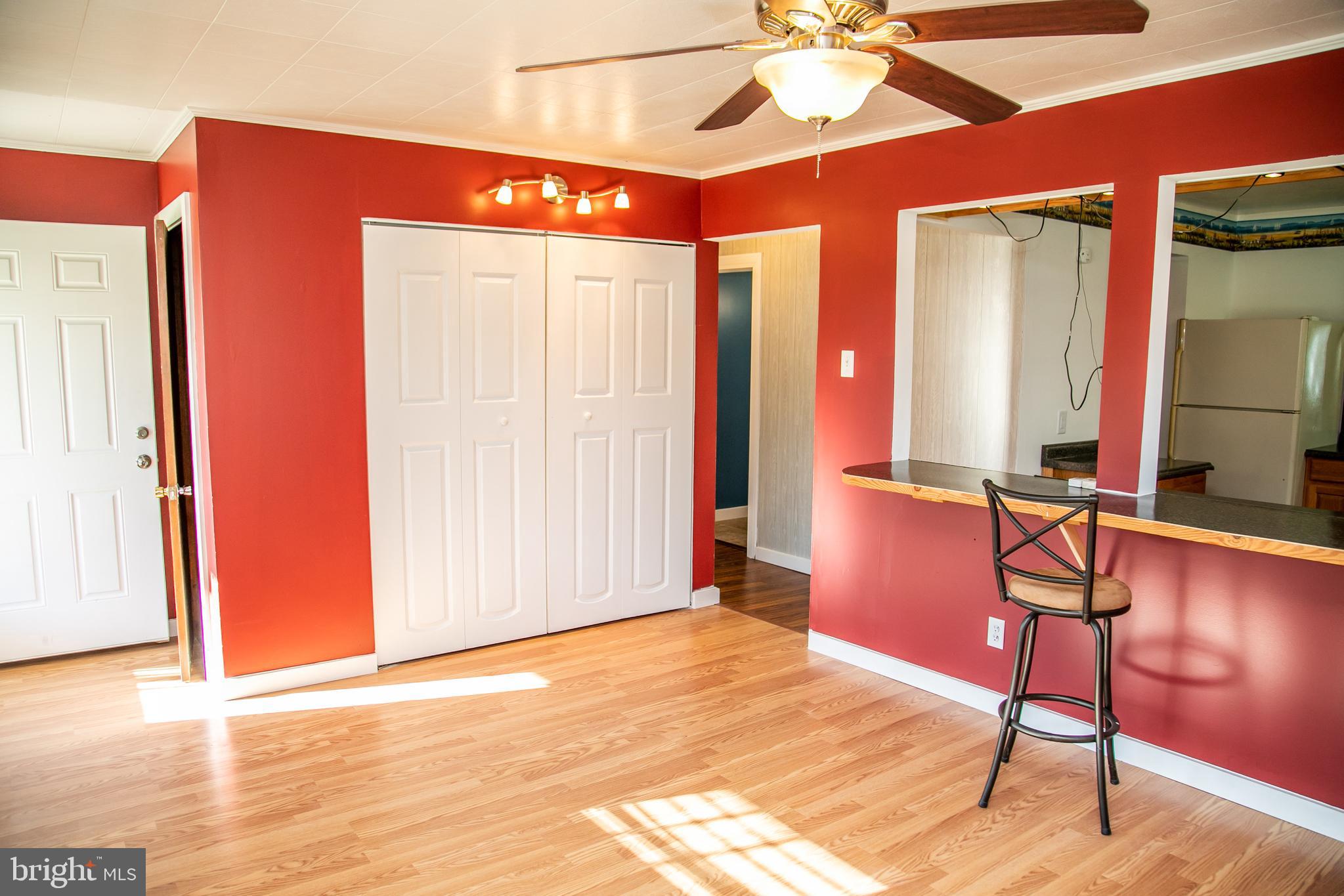 20135 Nanticoke Road Nanticoke, MD 21840 - Photo 18 of 47 a view of a livingroom with furniture and front door