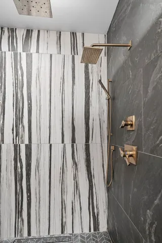 a bathroom with a shower and a tub