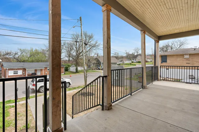 a view of a street from a balcony