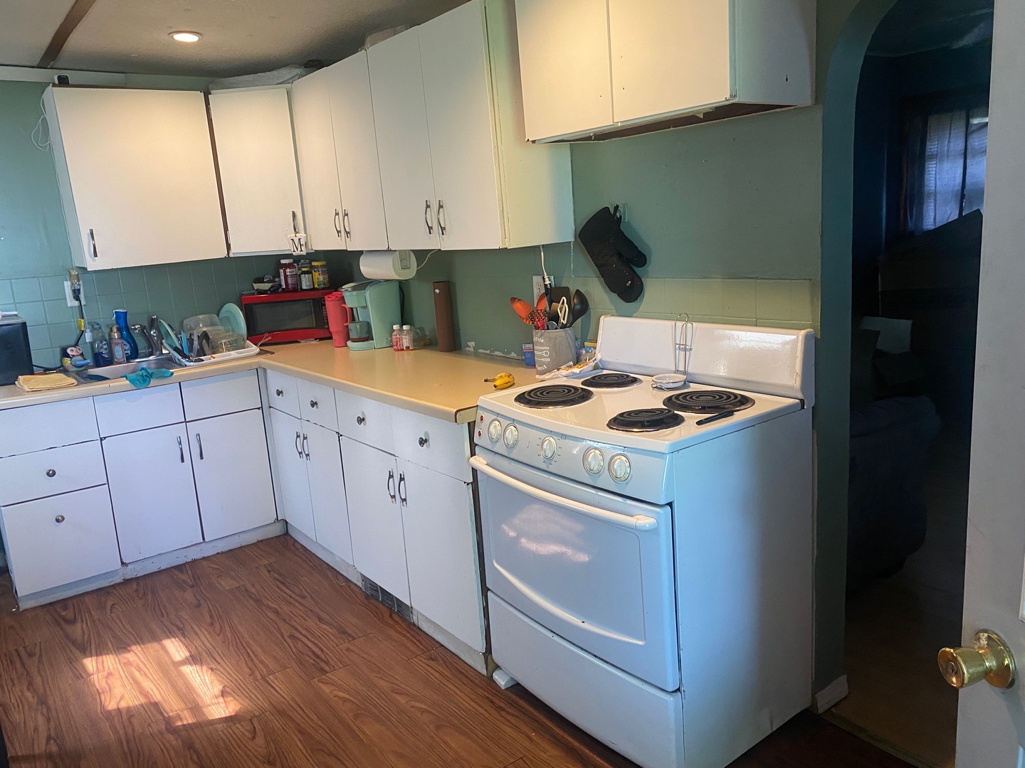 414 South Main Street Cherry, IL 61317 - Photo 11 of 18 a kitchen with granite countertop white cabinets and white appliances