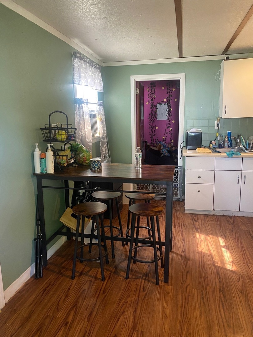 414 South Main Street Cherry, IL 61317 - Photo 10 of 18 a living room with furniture and wooden floor