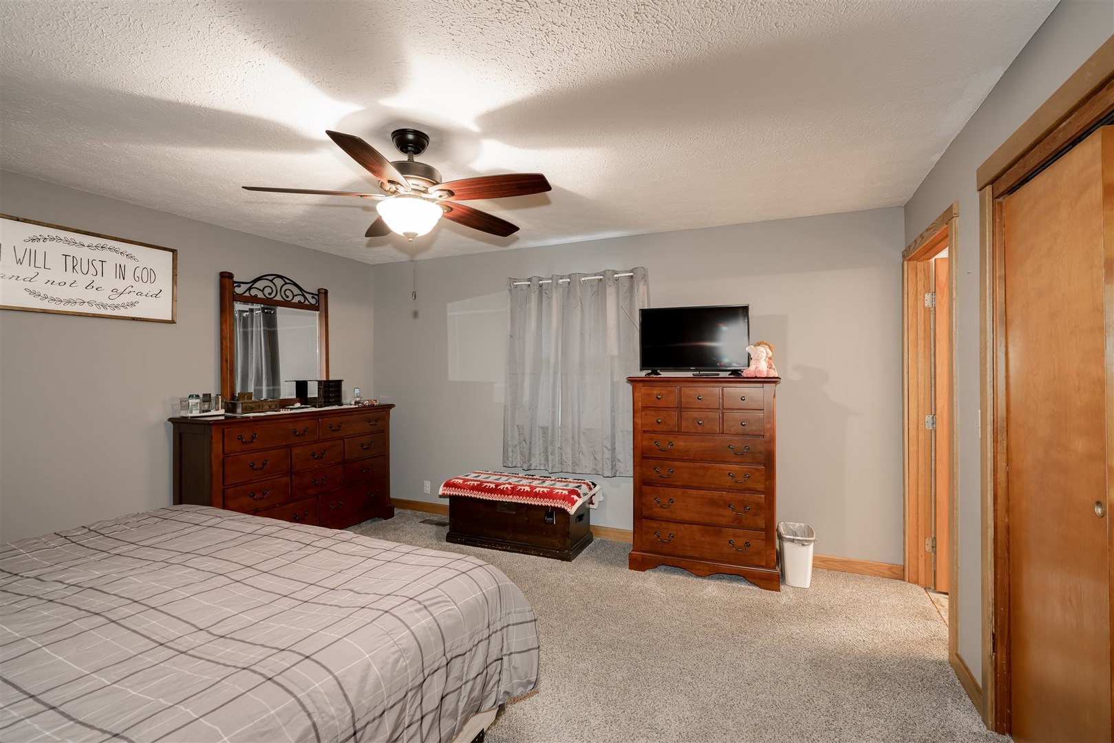34732 Peine Road Minier, IL 61759 - Photo 22 of 39 a bedroom with a bed and a flat screen tv