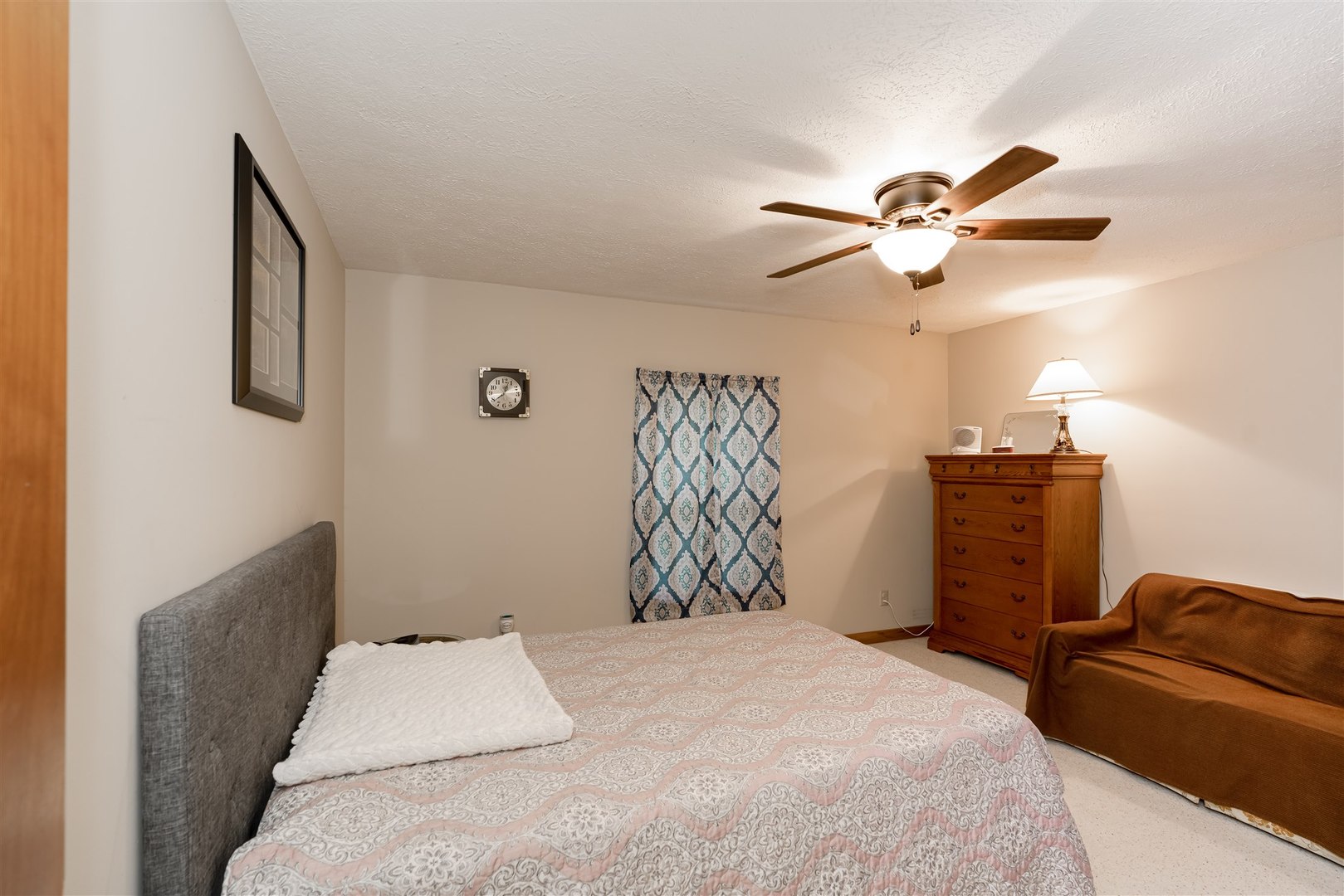 34732 Peine Road Minier, IL 61759 - Photo 25 of 39 a bedroom with a bed and a chandelier