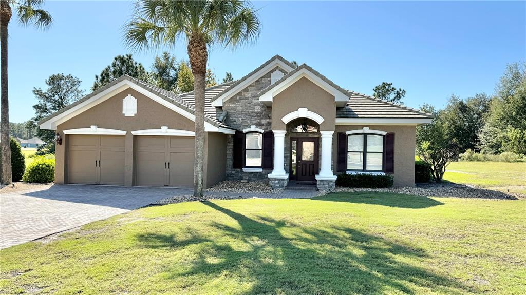 a front view of a house with a yard