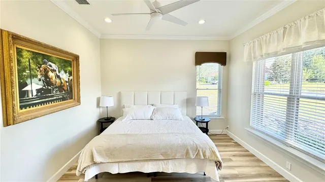 a bedroom with a large bed and a large window