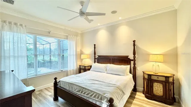 a bedroom with a large bed and a tv