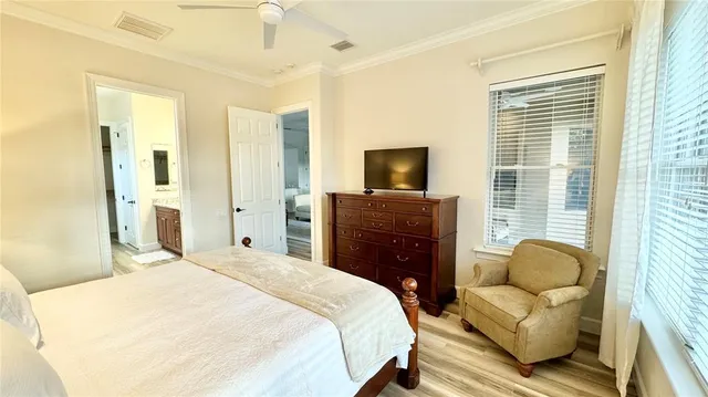 a bedroom with a bed and couch