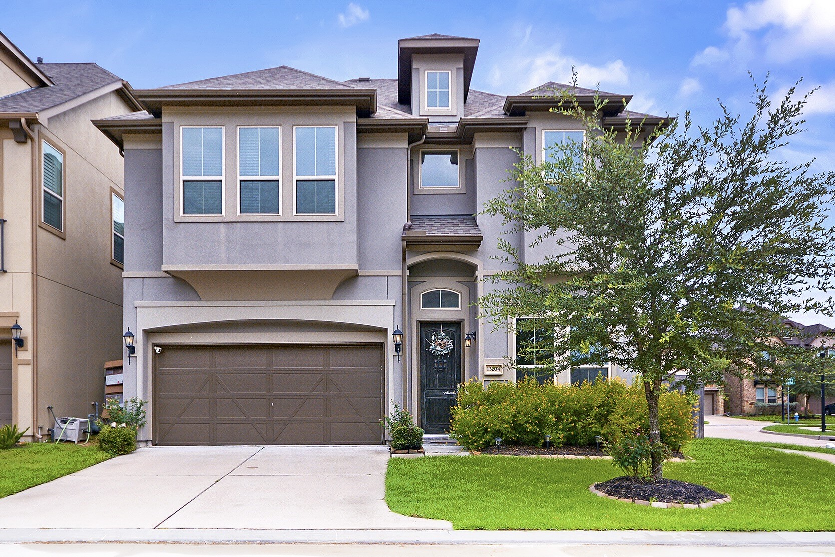 a front view of a house with garden