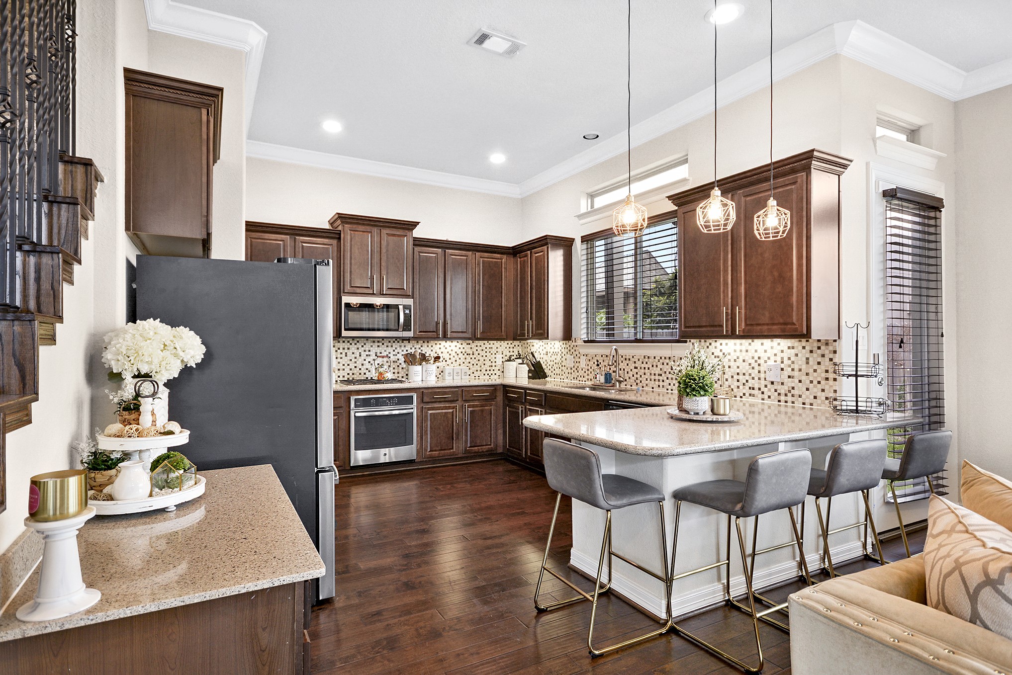 13204 Leighton Gardens Drive Houston, TX 77077 - Photo 12 of 35 a kitchen with stainless steel appliances kitchen island granite countertop a stove a sink and a refrigerator