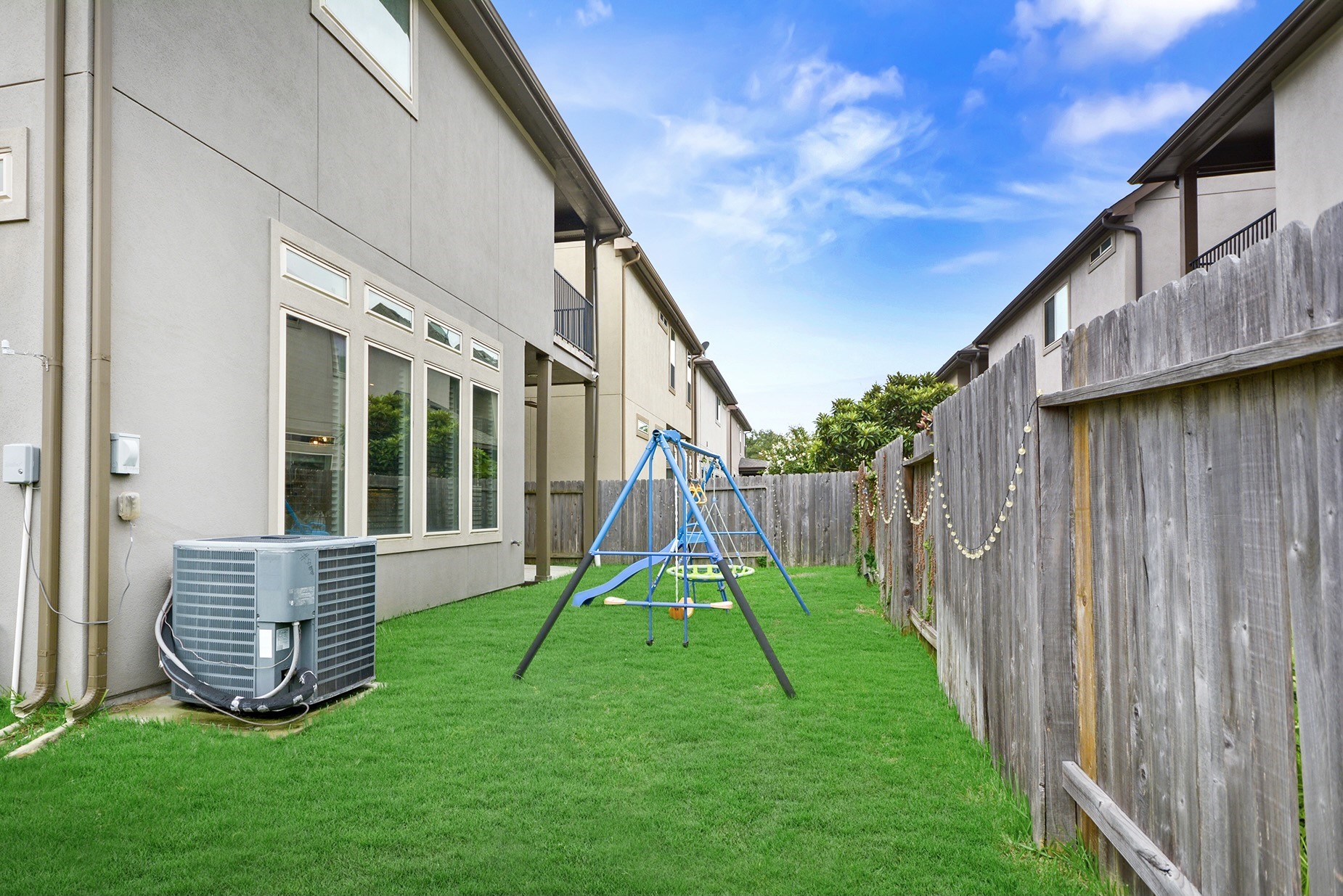 13204 Leighton Gardens Drive Houston, TX 77077 - Photo 28 of 35 a view of backyard with a slide and wooden fence