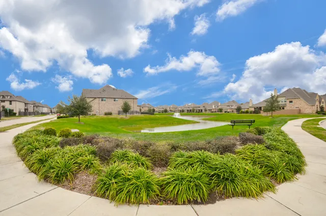 a view of a garden with an ocean