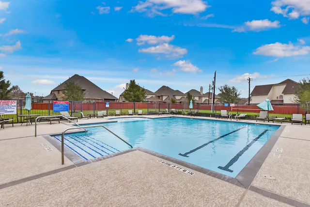 a view of swimming pool with outdoor seating