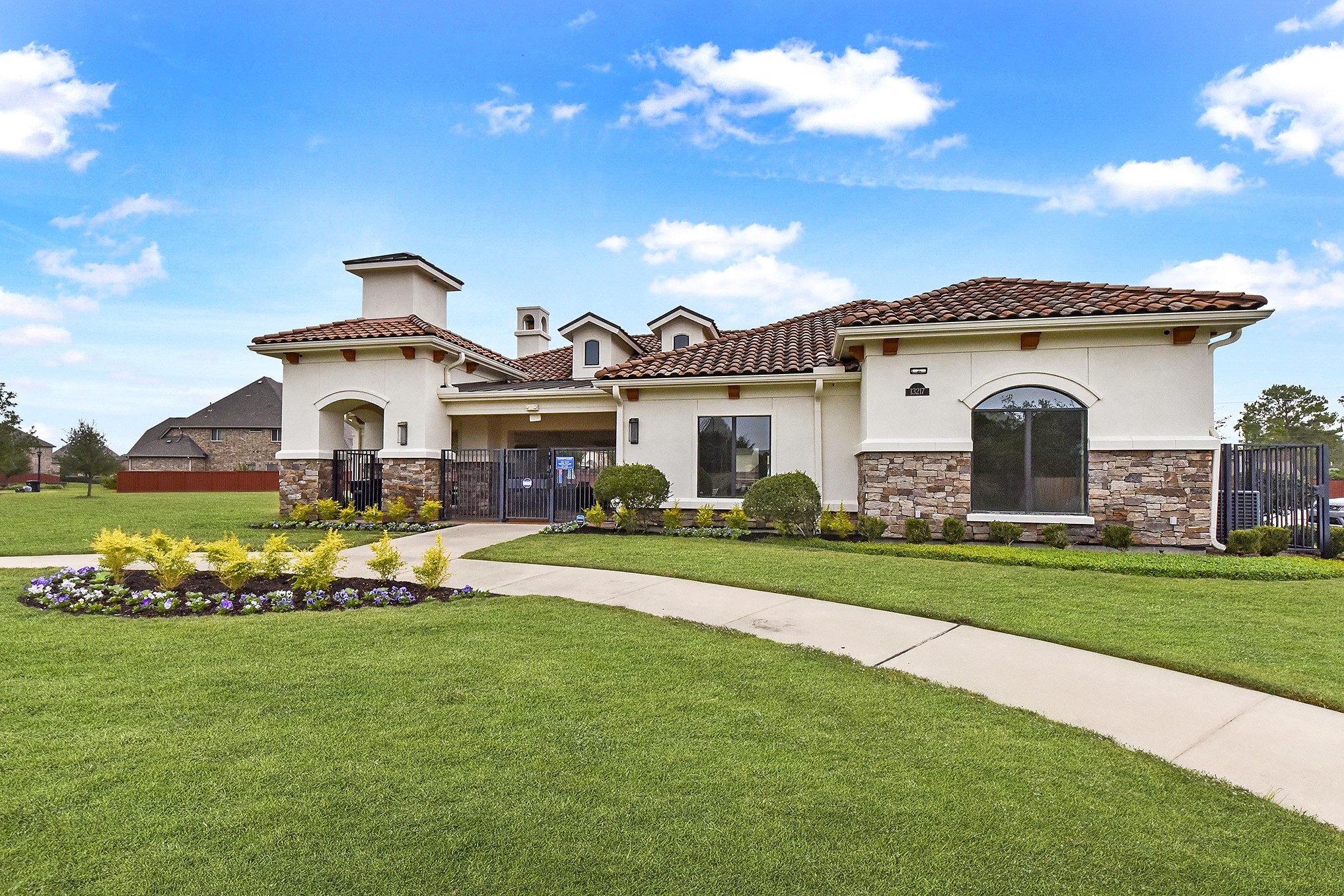 13204 Leighton Gardens Drive Houston, TX 77077 - Photo 32 of 35 a front view of a house with a garden and yard