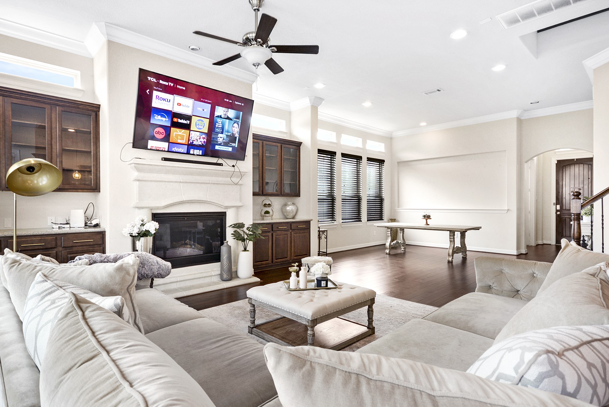 13204 Leighton Gardens Drive Houston, TX 77077 - Photo 7 of 35 a living room with furniture a fireplace and a flat screen tv