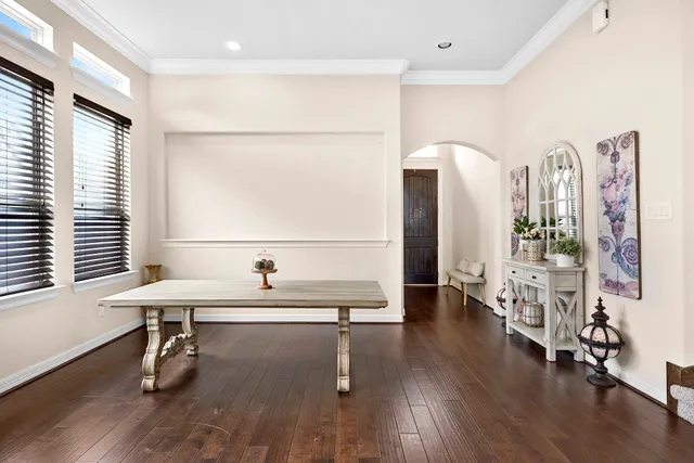 a room with lots of furniture and wooden floors