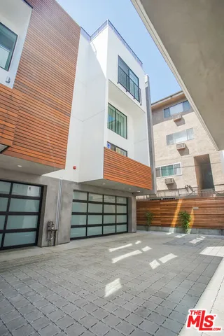 a front view of a house with a garage