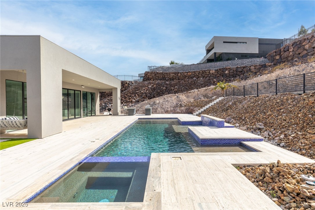 1455 MacDonald Ranch Drive Henderson, NV 89012 - Photo 39 of 46 View of pool with a patio area, fence, a fenced in pool, and an in ground hot tub